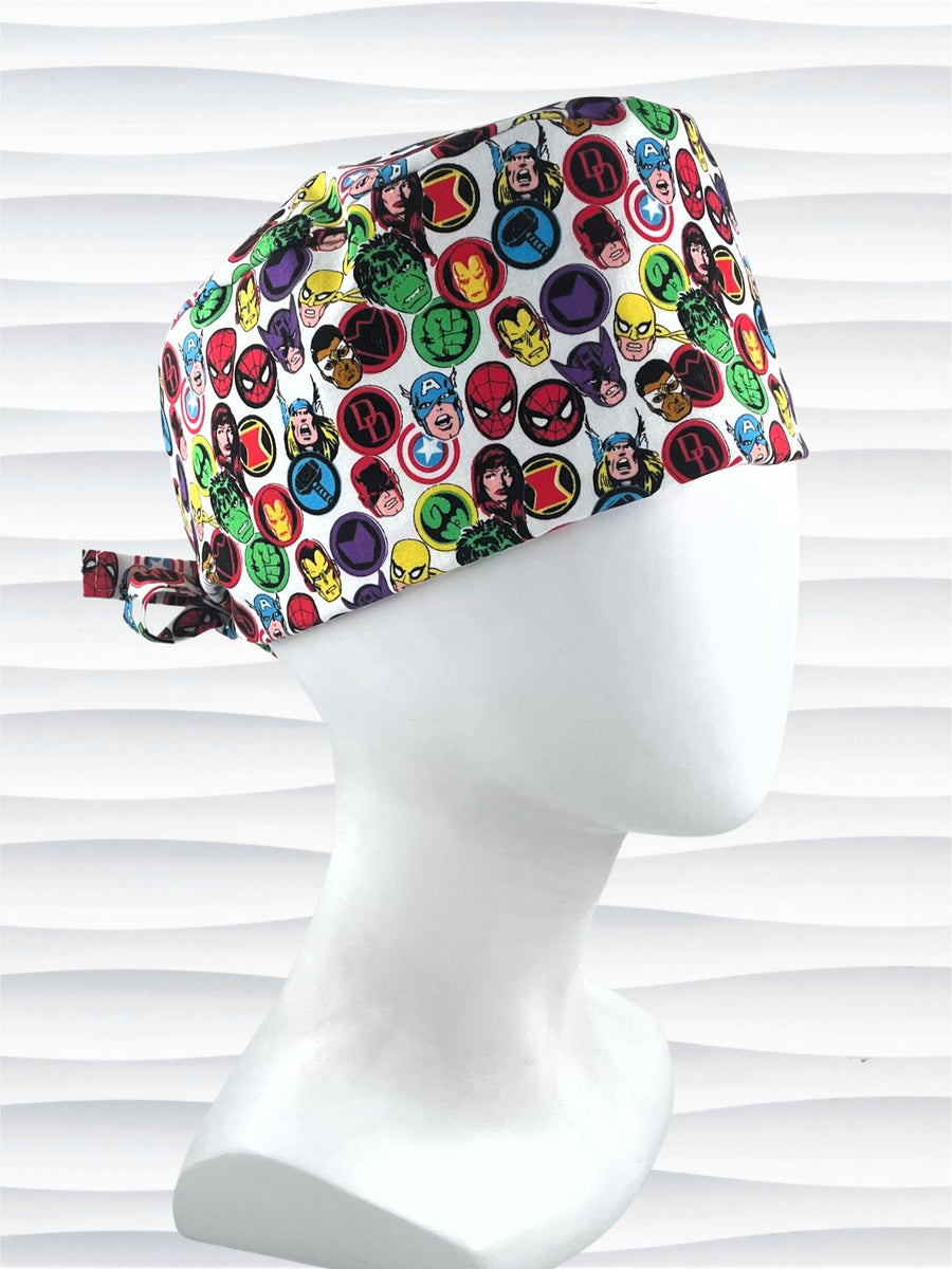 Surgeon style surgical scrub cap with classic Marvel Avengers superhero icons on white cotton fabric.