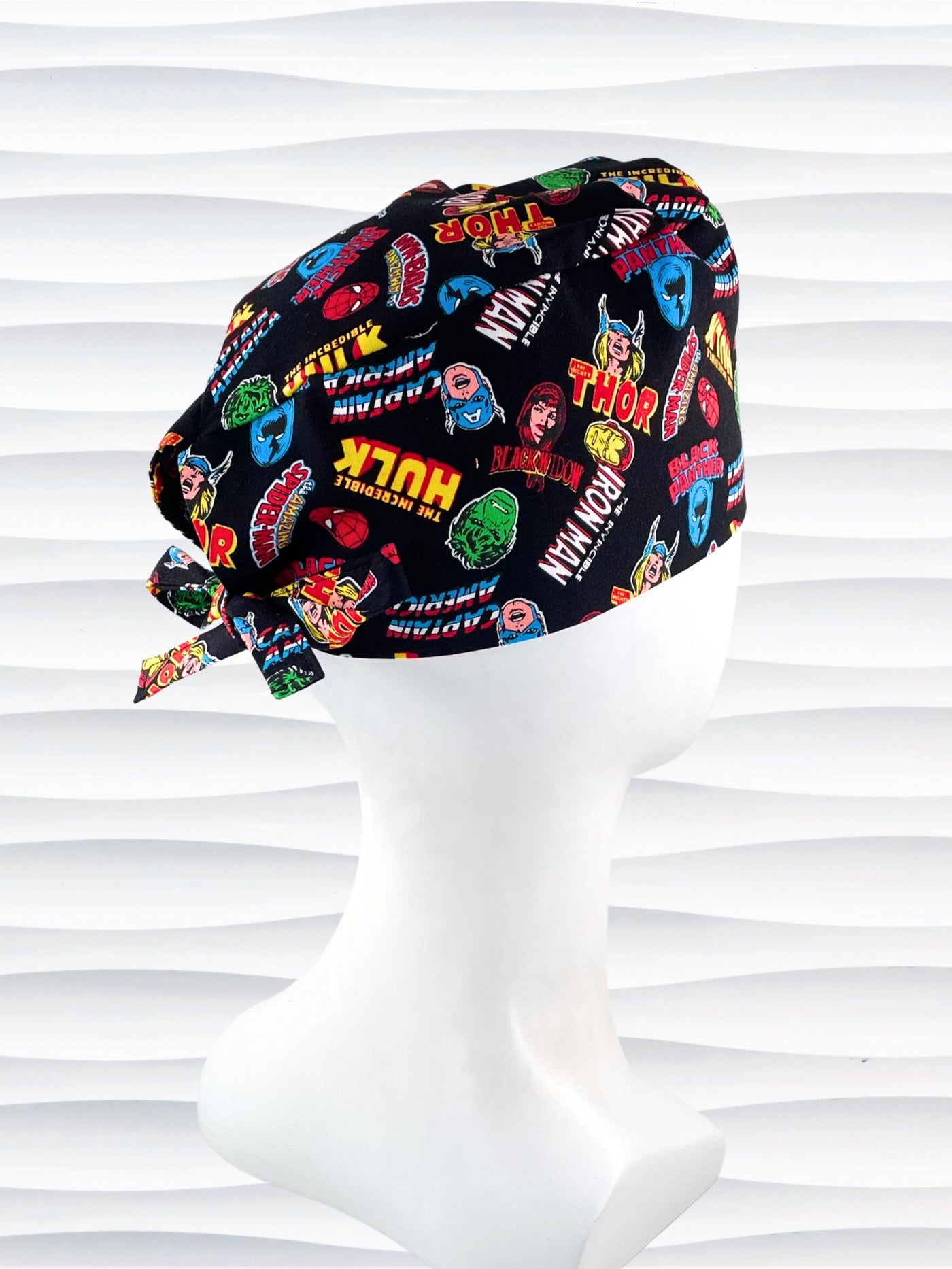 Surgeon style surgical scrub cap by JensCaps with iconic Marvel Avengers characters all over this black cotton fabric.