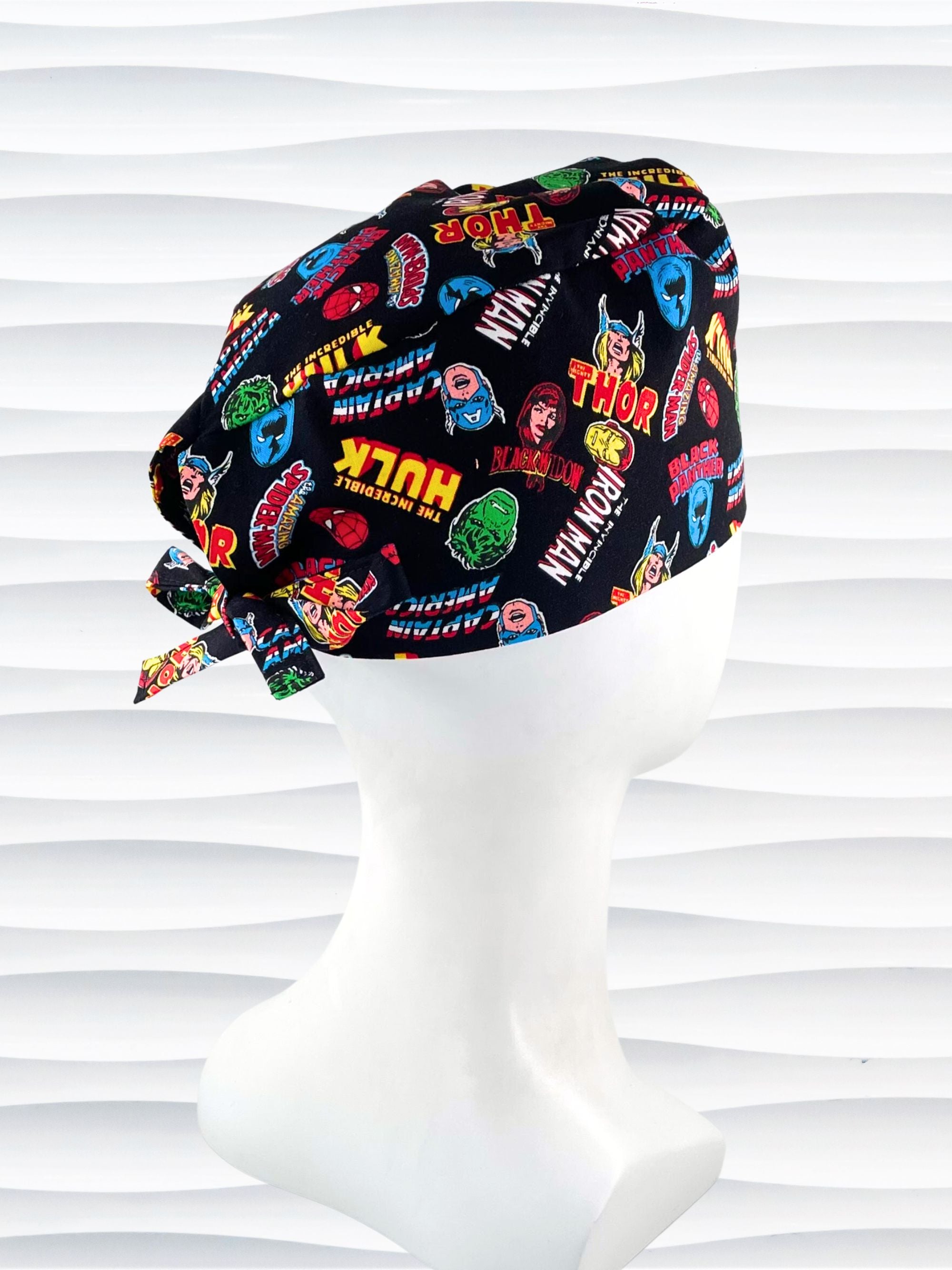 Surgeon style surgical scrub cap by JensCaps with iconic Marvel Avengers characters all over this black cotton fabric.