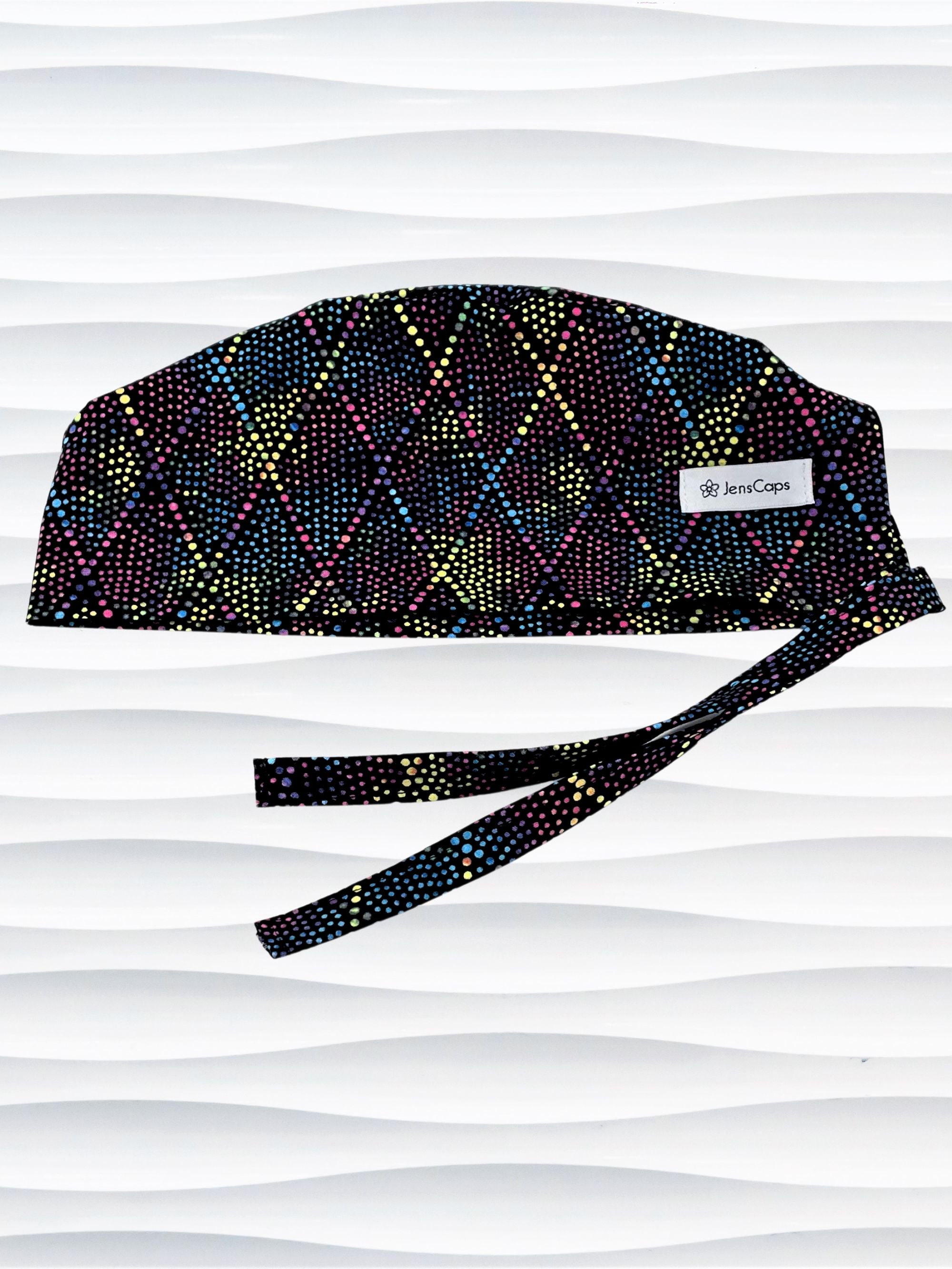 Surgeon Men's style surgical scrub cap hat with bright colored dots and lines in diamond shapes on black cotton fabric.