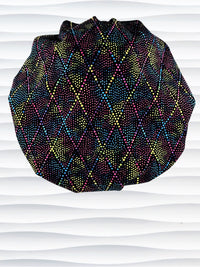 Bouffant style surgical scrub cap hat with abstract dots and lines in diamond shapes in bright colors on black cotton fabric.