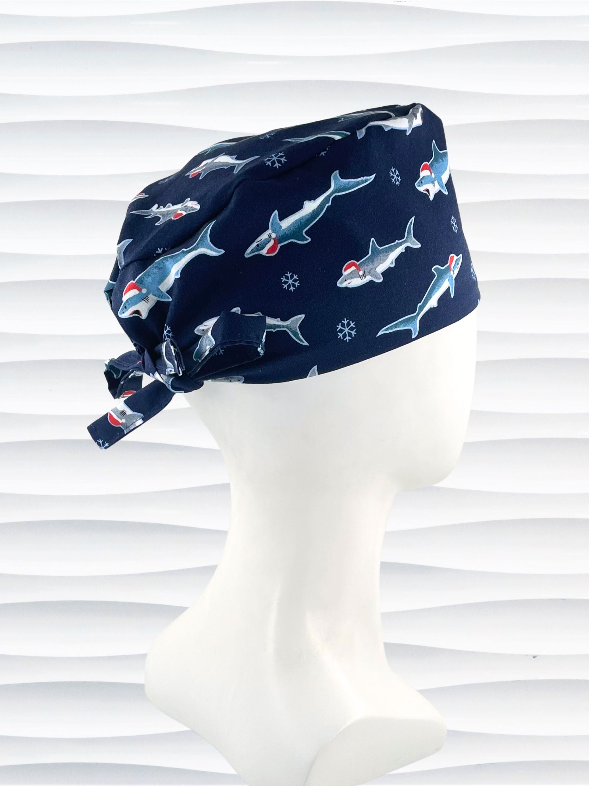 Mens Surgeon style surgical scrub cap hat with snowflakes and sharks wearing santa hats on dark blue cotton fabric