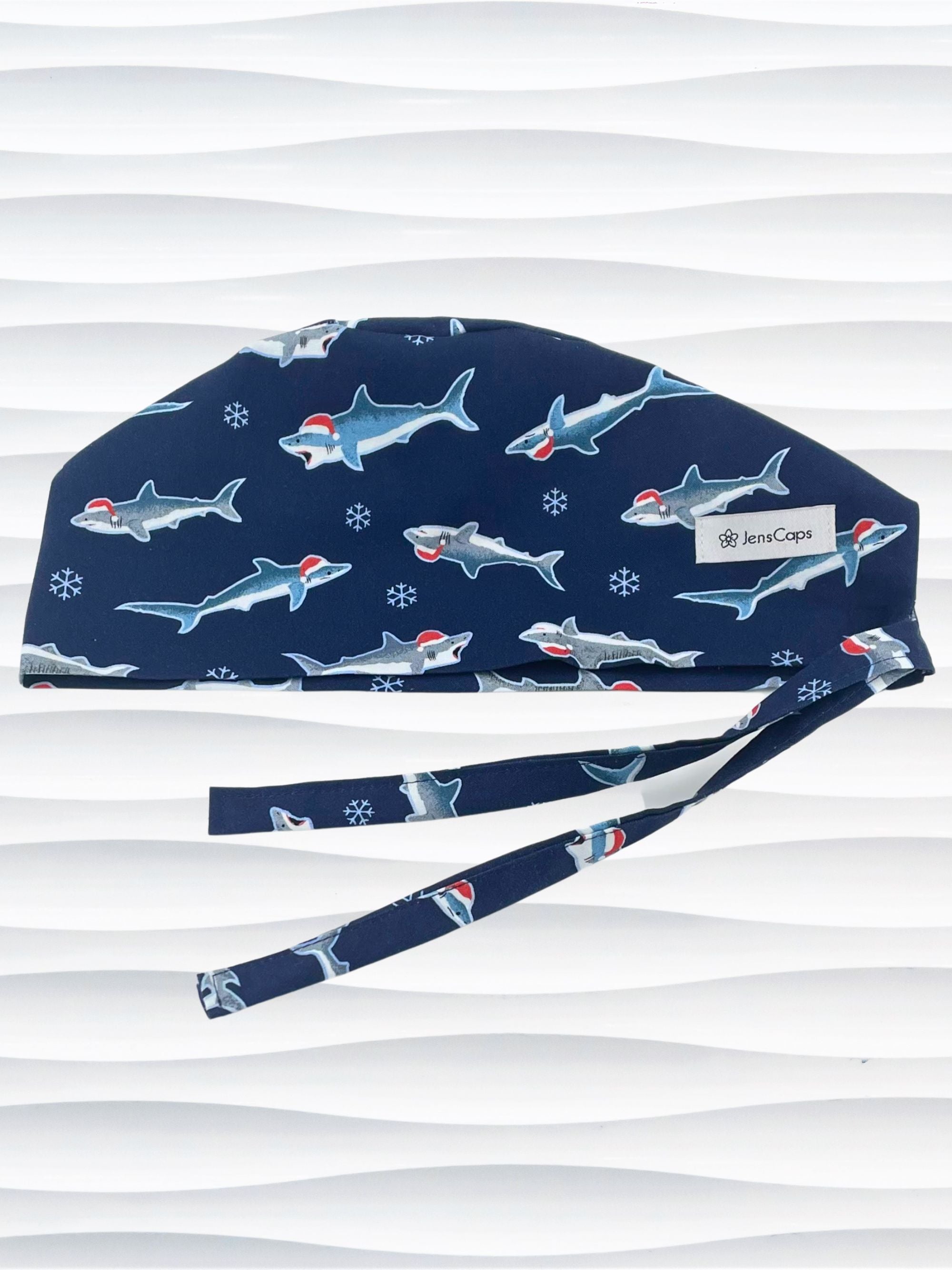 Mens Surgeon style surgical scrub cap hat with snowflakes and sharks wearing santa hats on dark blue cotton fabric