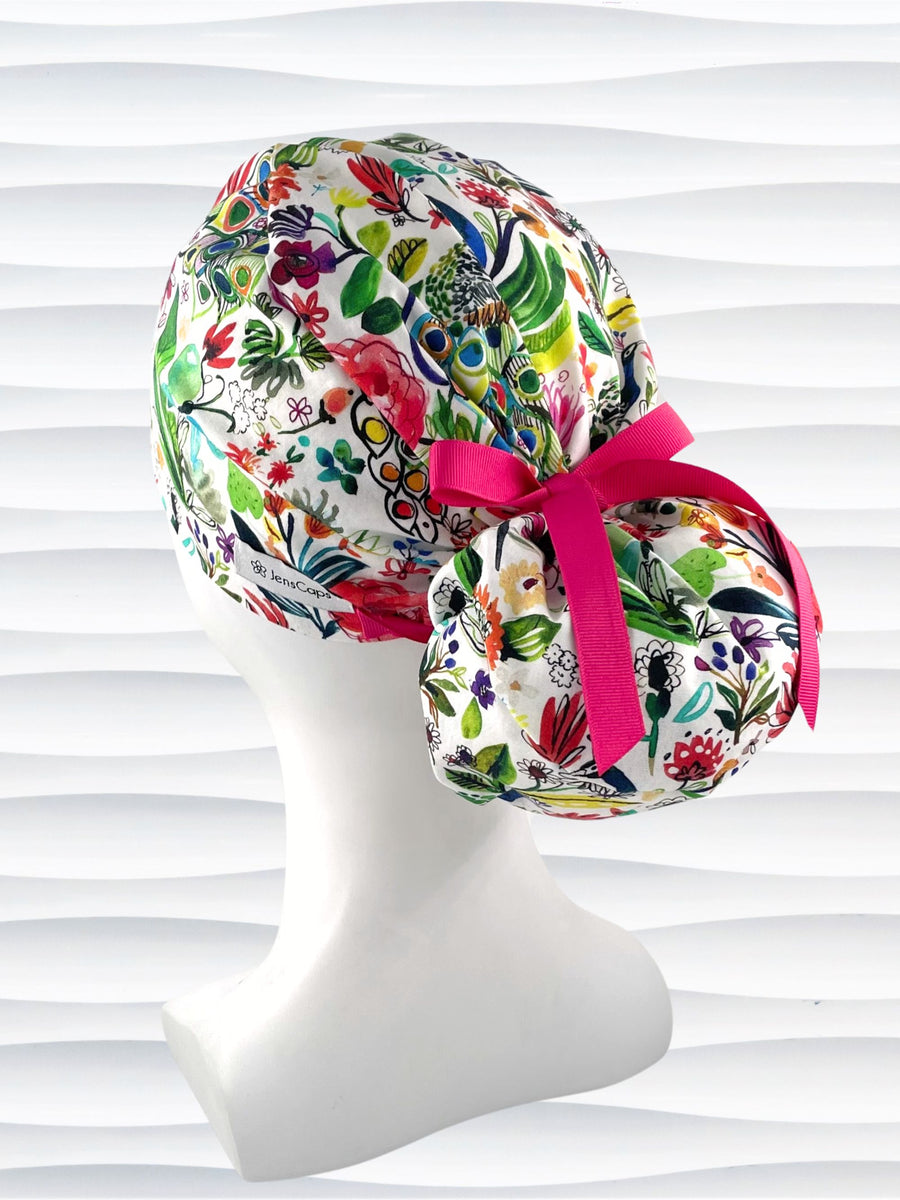 Euro Pony style surgical scrub cap hat for long  hair with bright flowers and peacocks on white cotton premium fabric.