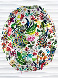 Euro Pony style surgical scrub cap hat for long  hair with bright flowers and peacocks on white cotton premium fabric.