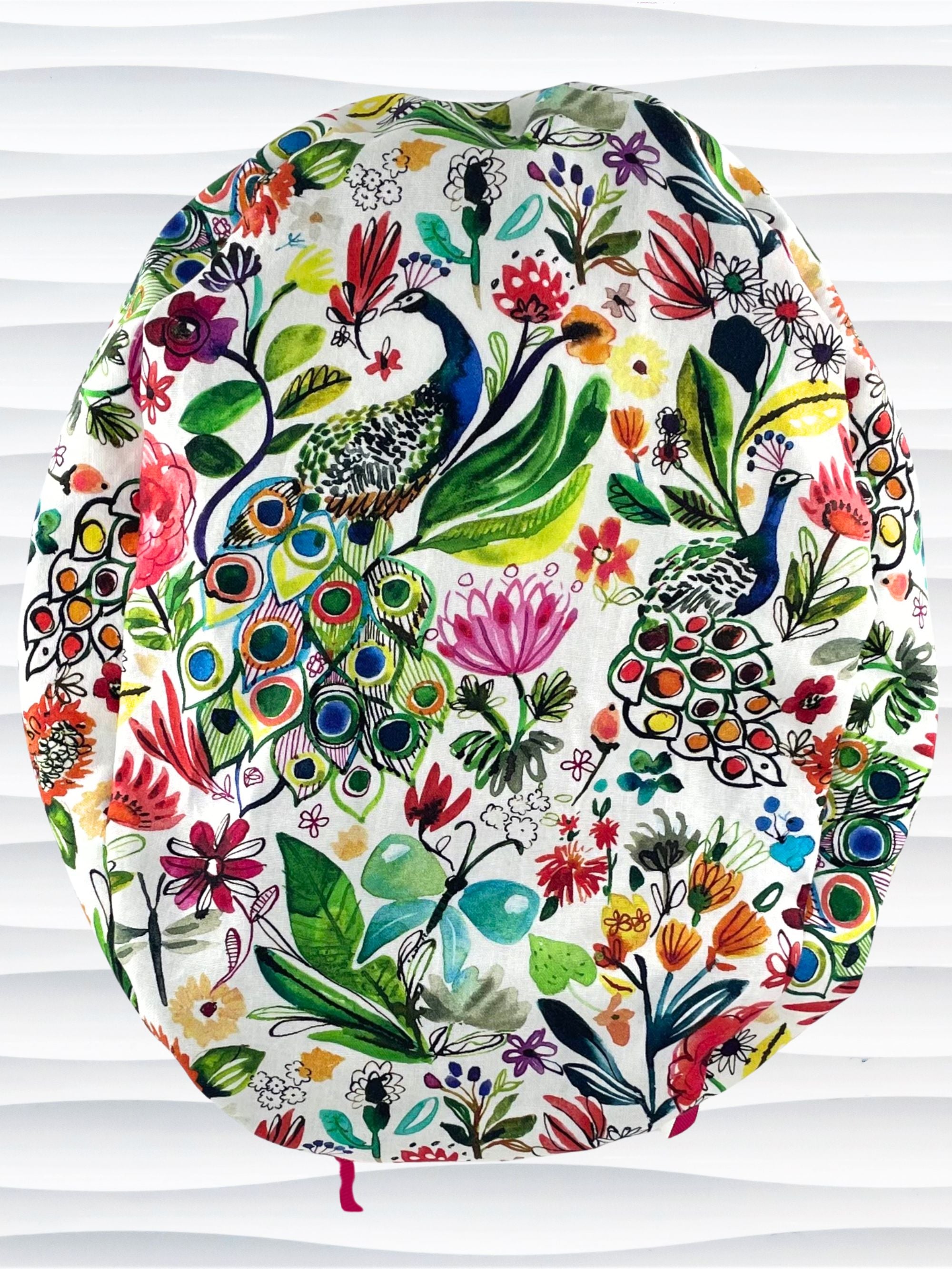 Euro Pony style surgical scrub cap hat for long  hair with bright flowers and peacocks on white cotton premium fabric.