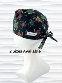 Surgeon style surgical scrub cap hat with turtles in orange and green on black cotton fabric
