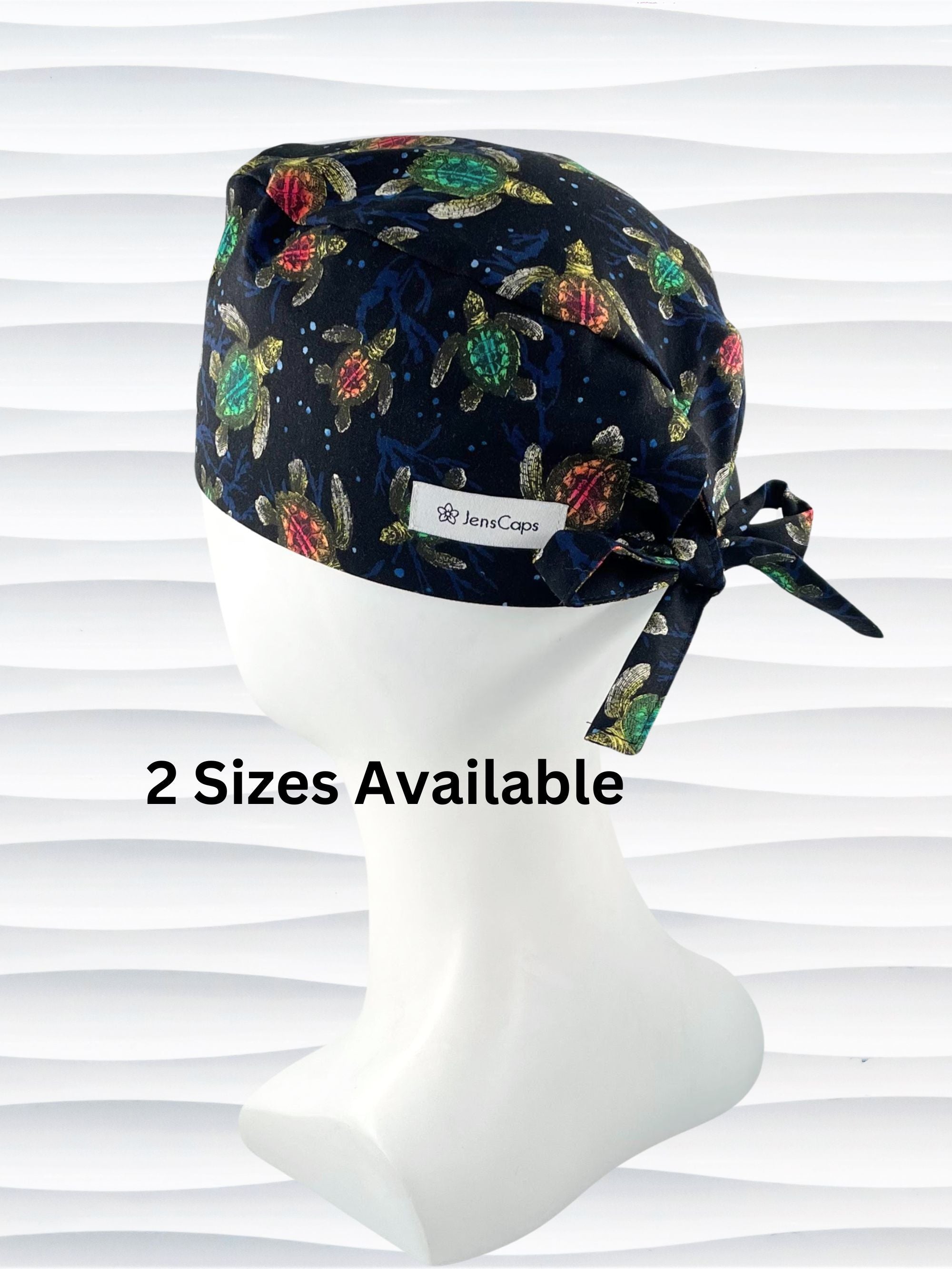 Surgeon style surgical scrub cap hat with turtles in orange and green on black cotton fabric