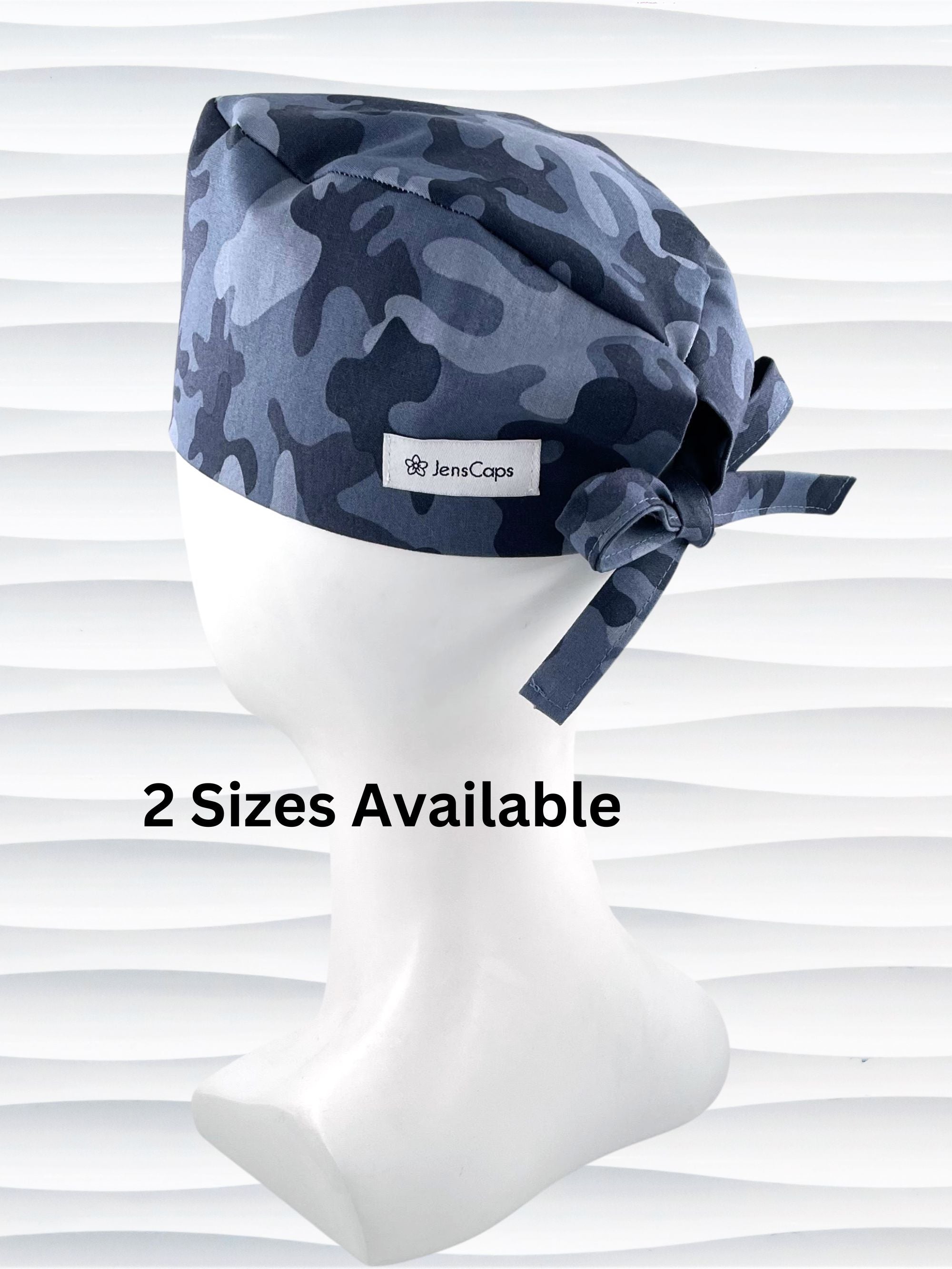 Surgeon style surgical scrub cap hat with an allover print of a steely blue gray camouflage on cotton fabric.